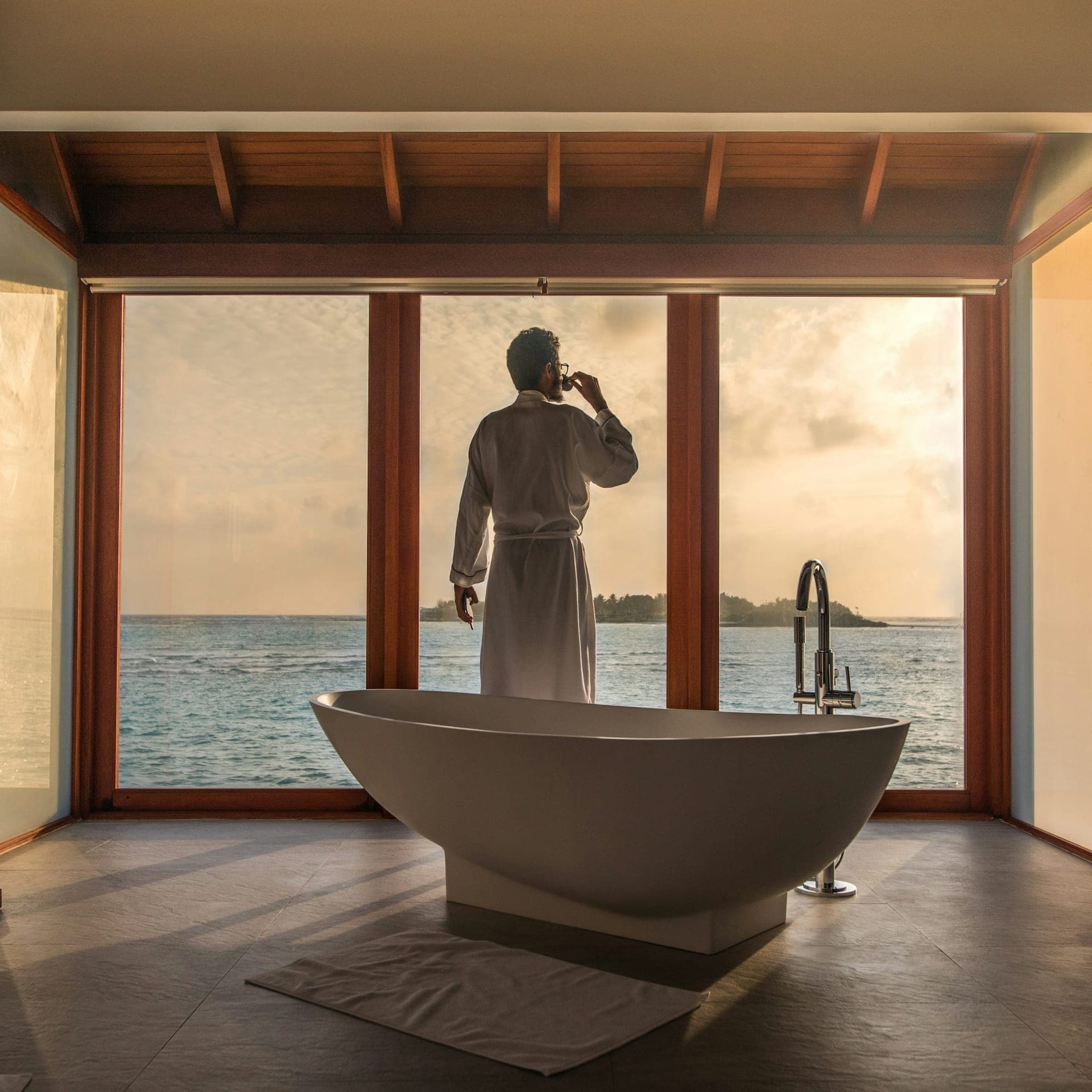 A bathroom opening onto water at first light